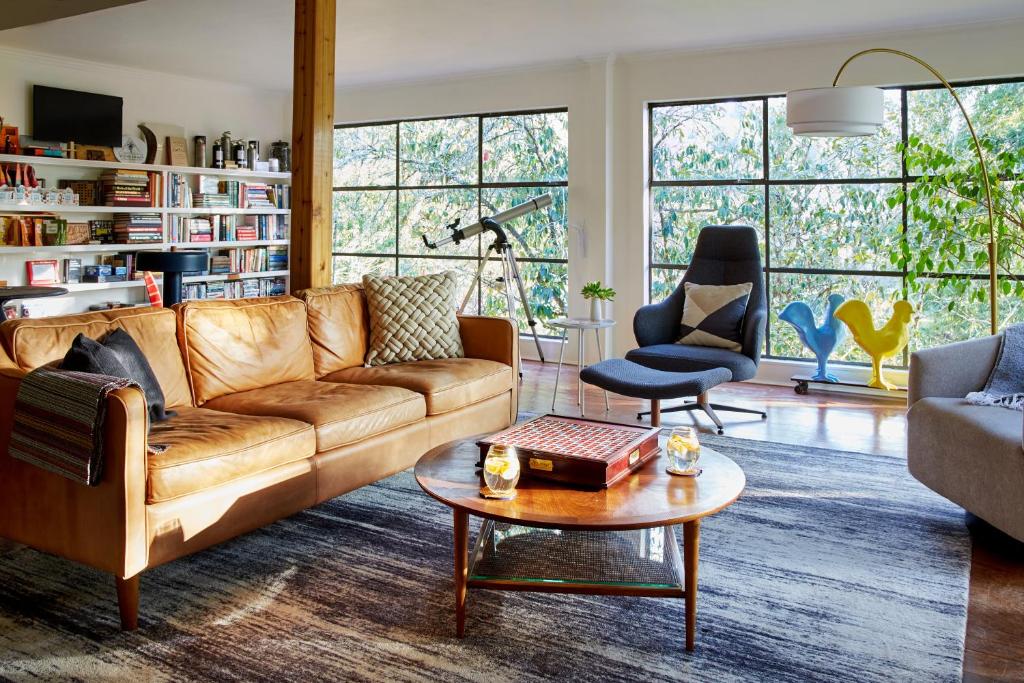 a living room with a couch and a table at Mine and Farm, The Inn at Guerneville, CA in Guerneville