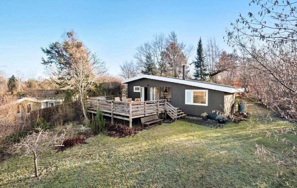 a tiny house in the middle of a field at Lovely Home In Jgerspris With Wifi in Jægerspris