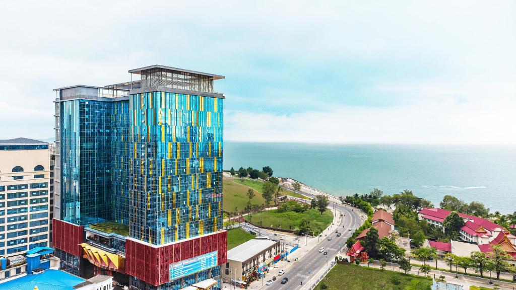 an aerial view of a tall building next to the ocean at Won Majestic Hotel Cambodia in Sihanoukville