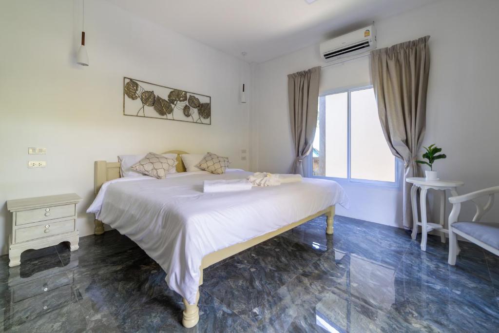 Postel nebo postele na pokoji v ubytování Apple Villas