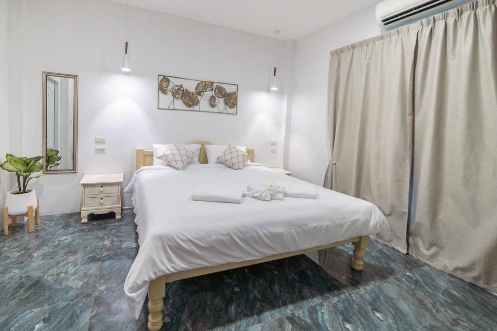 Postel nebo postele na pokoji v ubytování Apple Villas