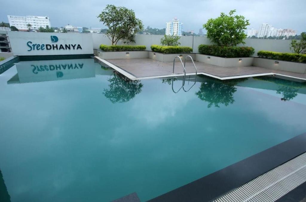 a pool with blue water on top of a building at Heaven vantage point in Trivandrum