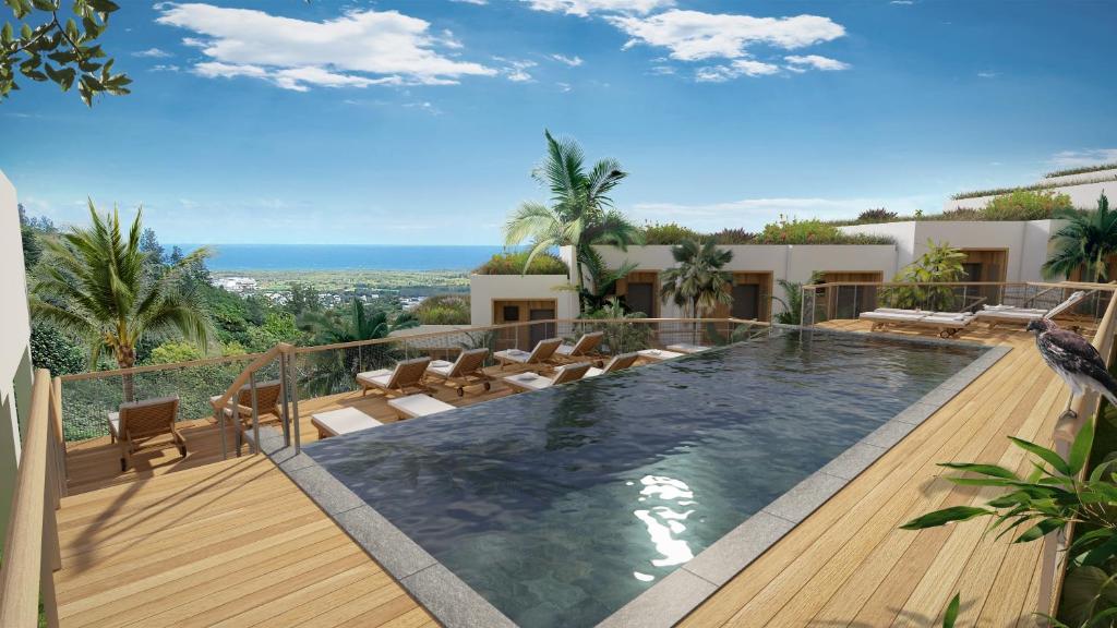 a swimming pool on top of a house at Papangue Hôtel & Spa in Étang-Salé