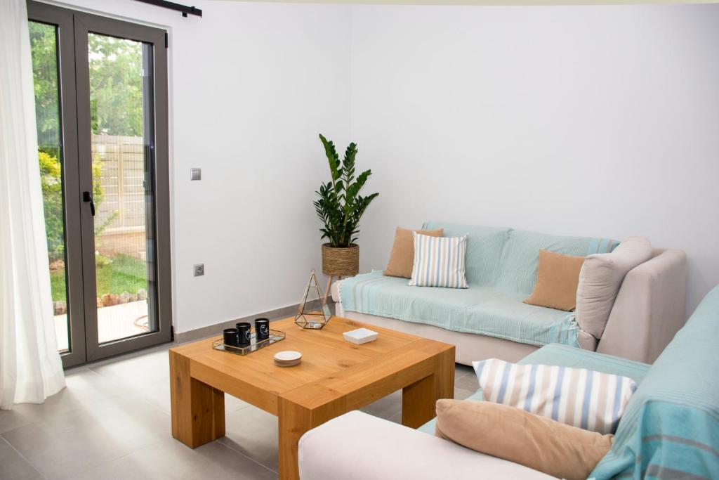 A seating area at Christina Apartment
