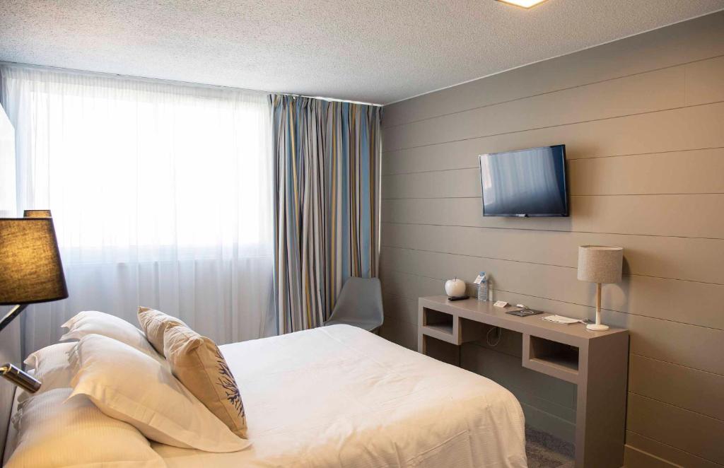 TV a/nebo společenská místnost v ubytování Hotel Port Marine