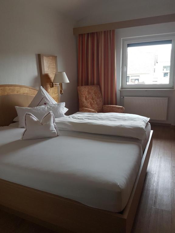 Postel nebo postele na pokoji v ubytování Hotel Mühlenthal GmbH
