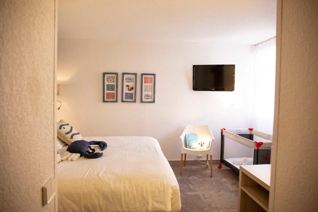 Postel nebo postele na pokoji v ubytování Hotel Port Marine