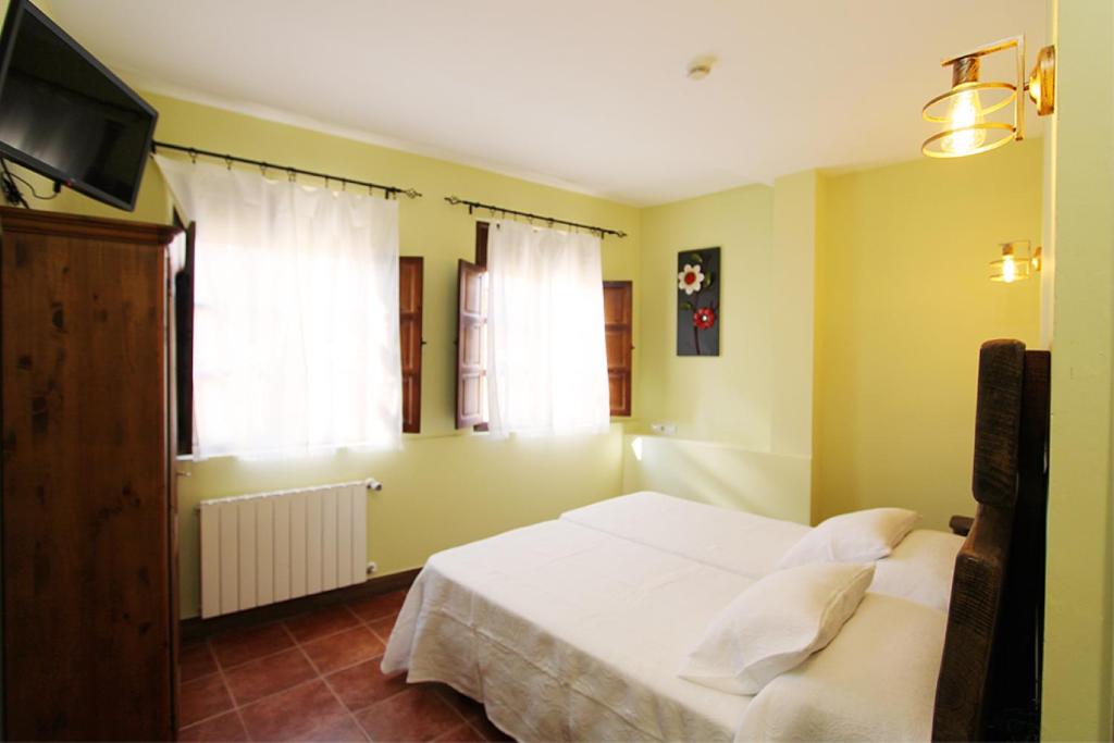 Postel nebo postele na pokoji v ubytování Hotel Rural Frías