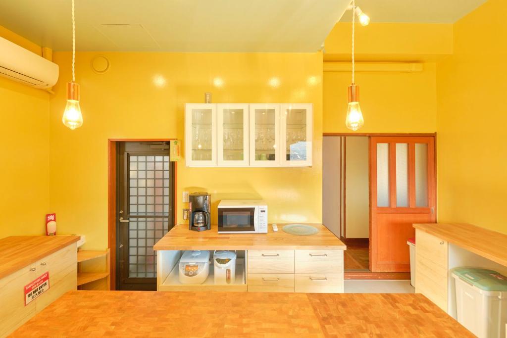 Kuchyň nebo kuchyňský kout v ubytování Ryokan -Suikoen-
