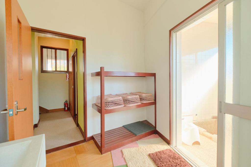 Postel nebo postele na pokoji v ubytování Ryokan -Suikoen-