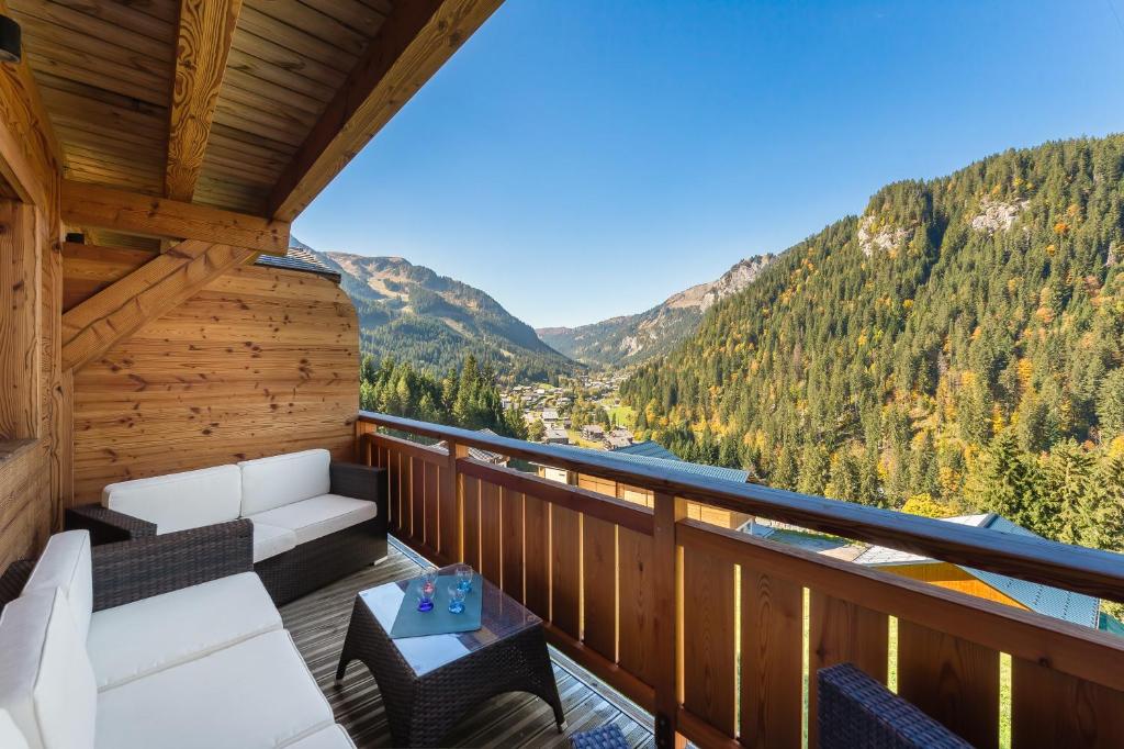 a balcony with a view of a river and mountains at Etringa 8 - Chalet Mitoyen - BO Immobilier- remises sur les forfaits de skis Châtel ou Portes du soleil in Châtel
