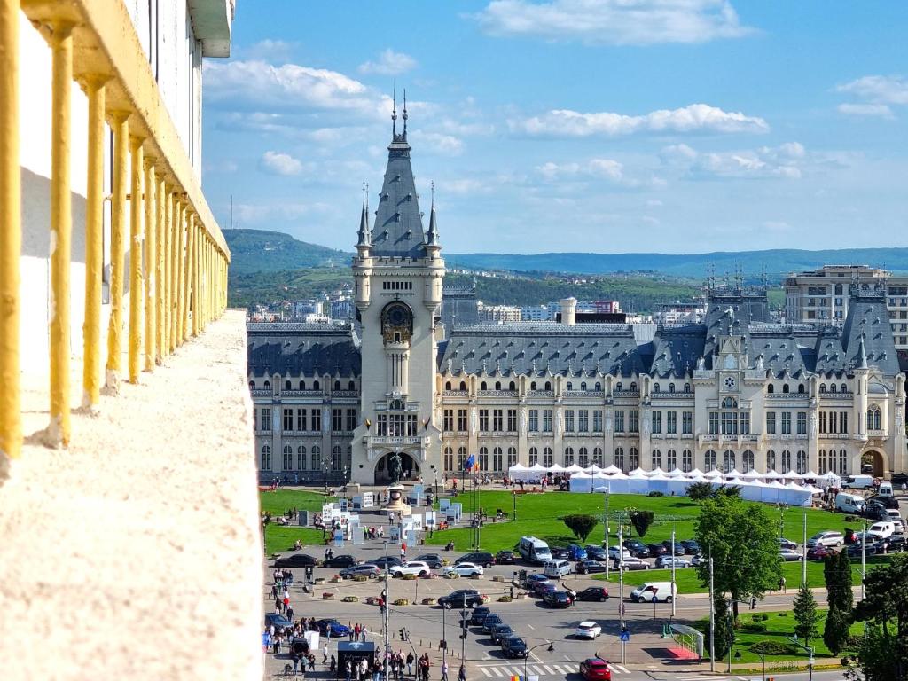 a view of a large building with a clock tower at Inima Iasului - Central View Apartment in Iaşi