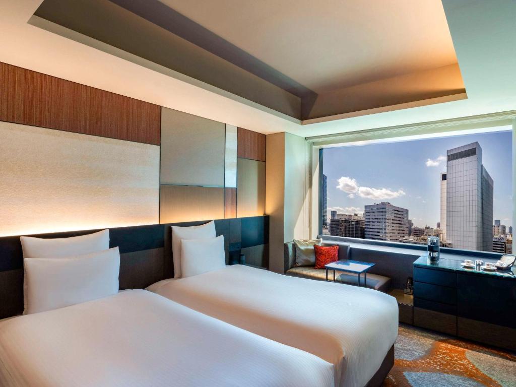Postel nebo postele na pokoji v ubytování Pullman Tokyo Tamachi