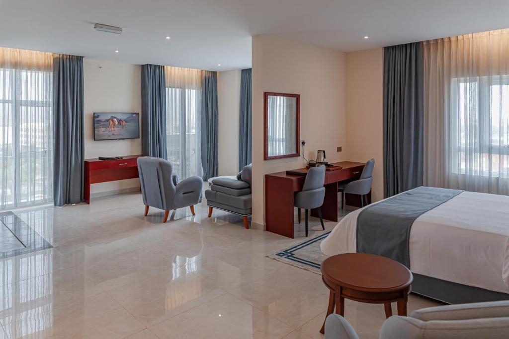 Postel nebo postele na pokoji v ubytování Salalah International Hotel