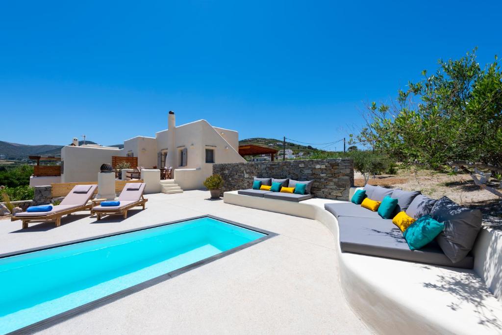 a villa with a swimming pool and a house at Princess Sofia Luxury Villa (with private pool) in Kampos Paros