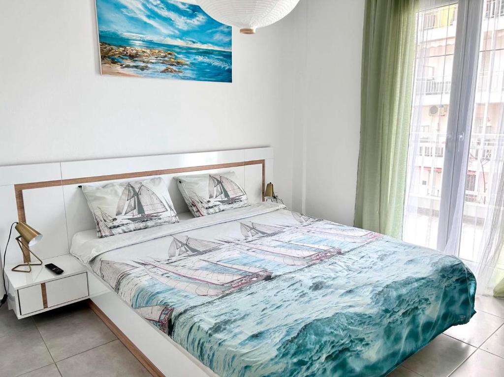 מיטה או מיטות בחדר ב-Sea Pleasure Apartment II