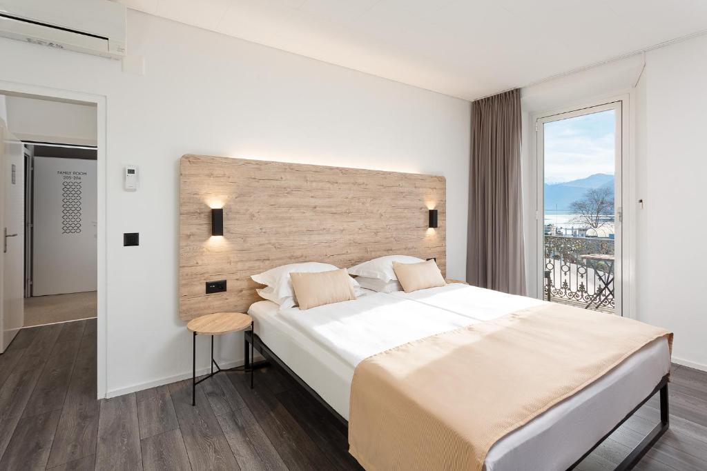 Postel nebo postele na pokoji v ubytování Hotel Du Lac