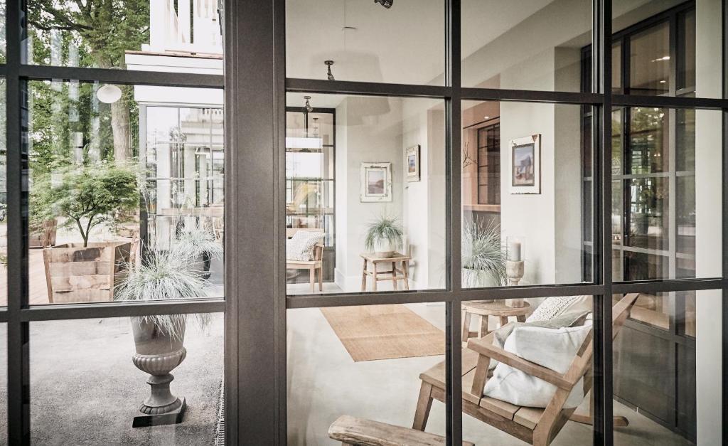 a room with a view of a living room at The Cozy Hotel & Lofts Timmendorfer Strand in Timmendorfer Strand