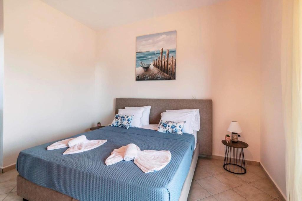 Postel nebo postele na pokoji v ubytování INFINITY BLU VILLA