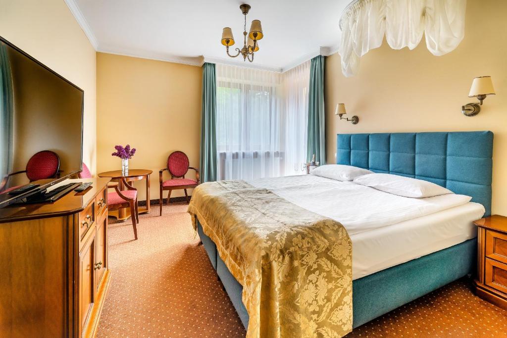 Posteľ alebo postele v izbe v ubytovaní Hotel Pan Tadeusz