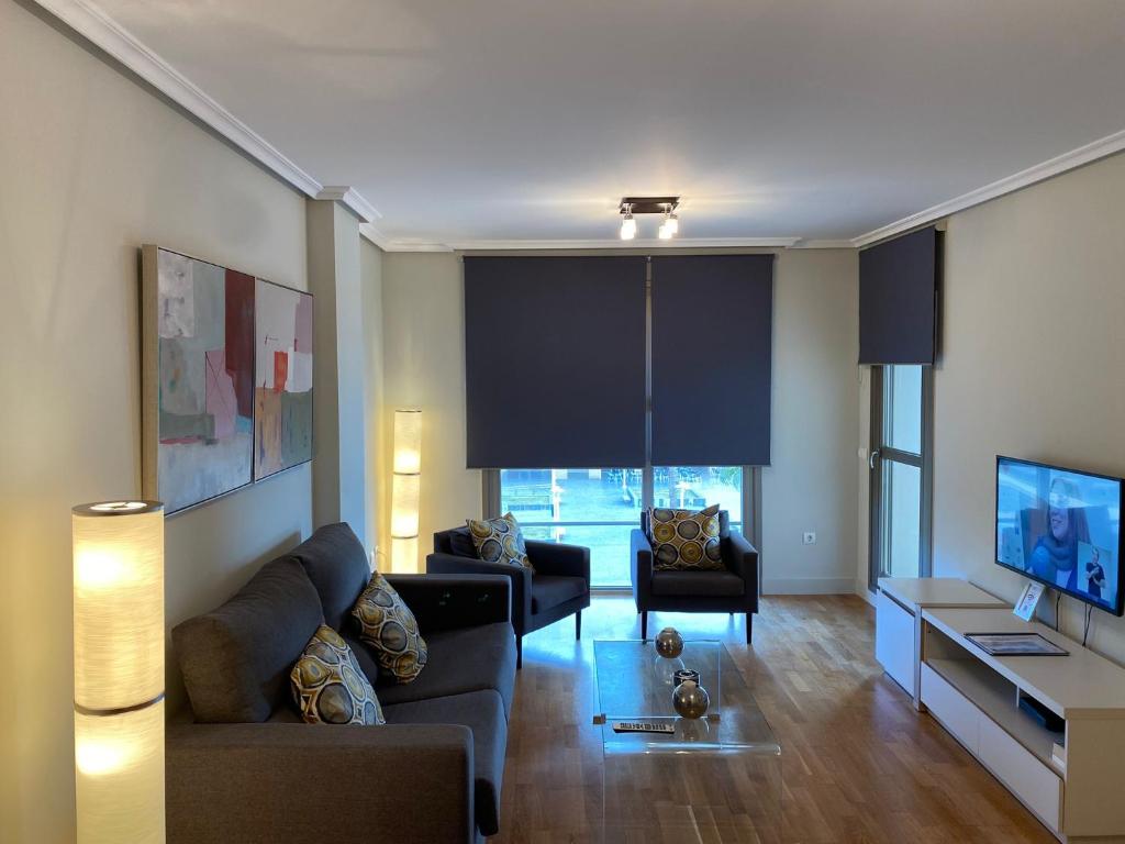 Televízia a/alebo spoločenská miestnosť v ubytovaní Playa Pacífico Apartment