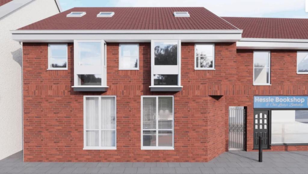a rendering of a brick building with white windows at Studios 21- By Eazy Rooms in Hessle