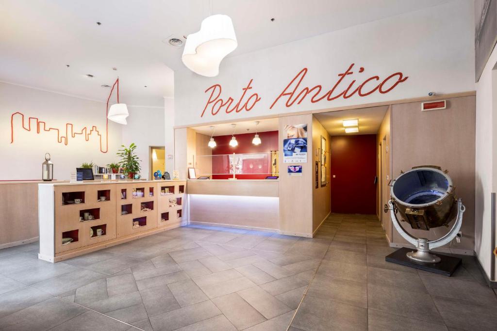 a store with a public institute sign on the wall at Best Western Porto Antico in Genoa