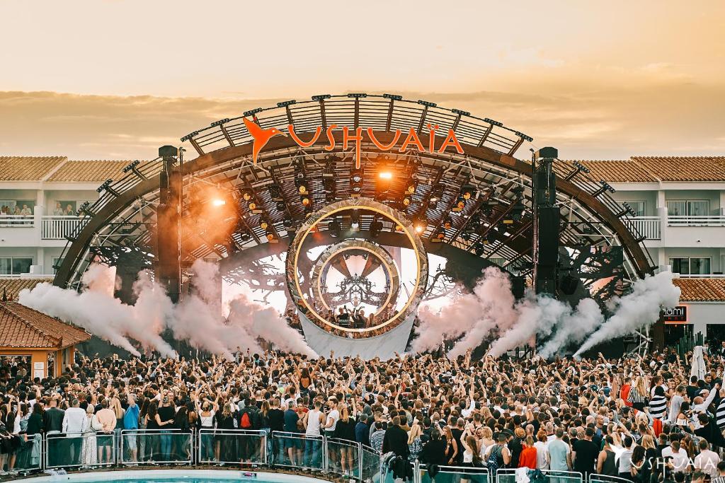 a large crowd of people in front of a concert at The Signature Level at TRS Ibiza Hotel - All Inclusive Adults Only - Entrance to Clubs included in San Antonio