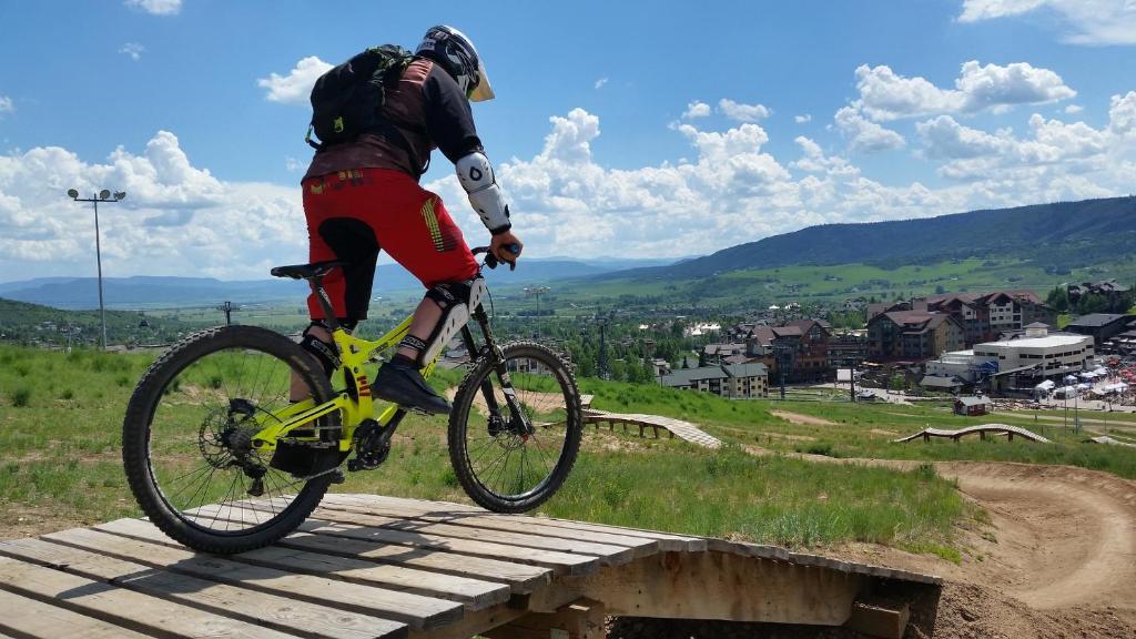 a person doing a trick on a bike on a ramp at Hotel Base Camp Lodge - Albertville in Albertville