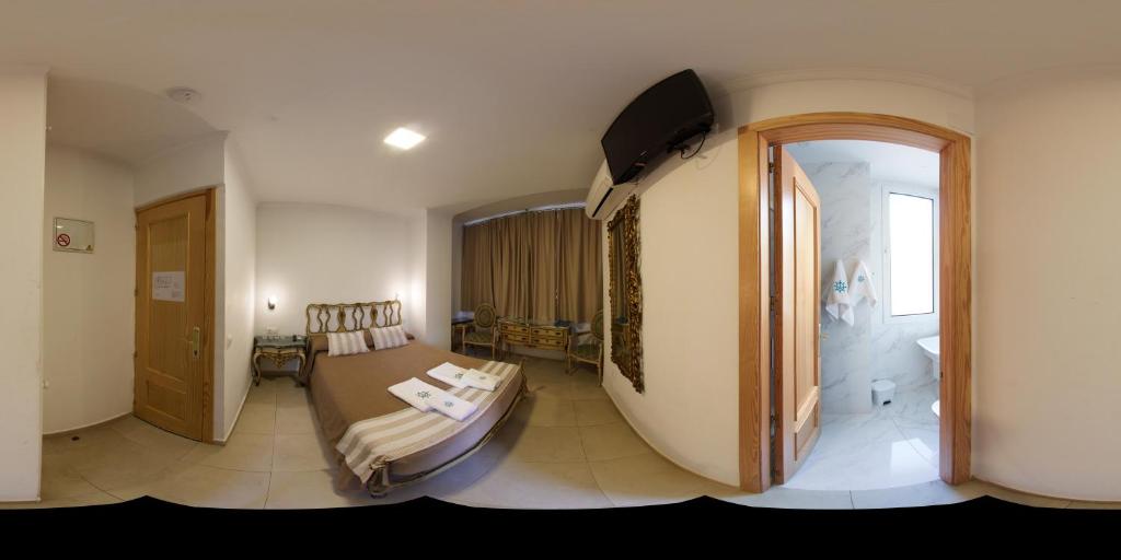 Cama o camas de una habitación en Hotel Marítimo Urban