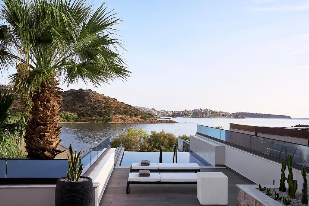 a house with a view of the water at The Sand Villas - 5star Living on the Beach in Agios Nikolaos