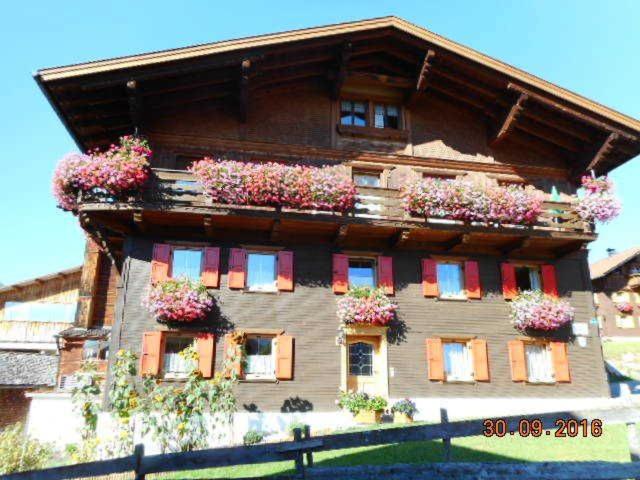 a house with flower boxes on the side of it at Haus Peintner in Tannheim