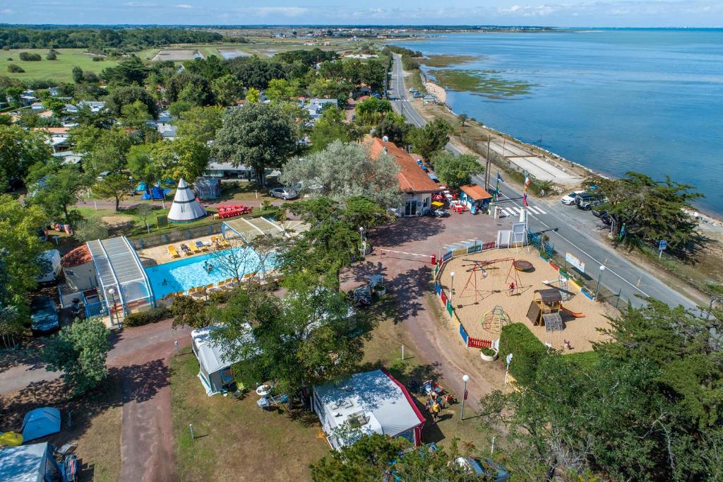 an aerial view of a park next to the water at Camping Ostréa **** in Dolus d'Oléron