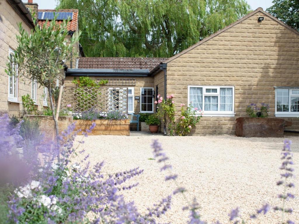 a house with a garden in front of it at 1 bed property in Easingwold 84002 in Crayke