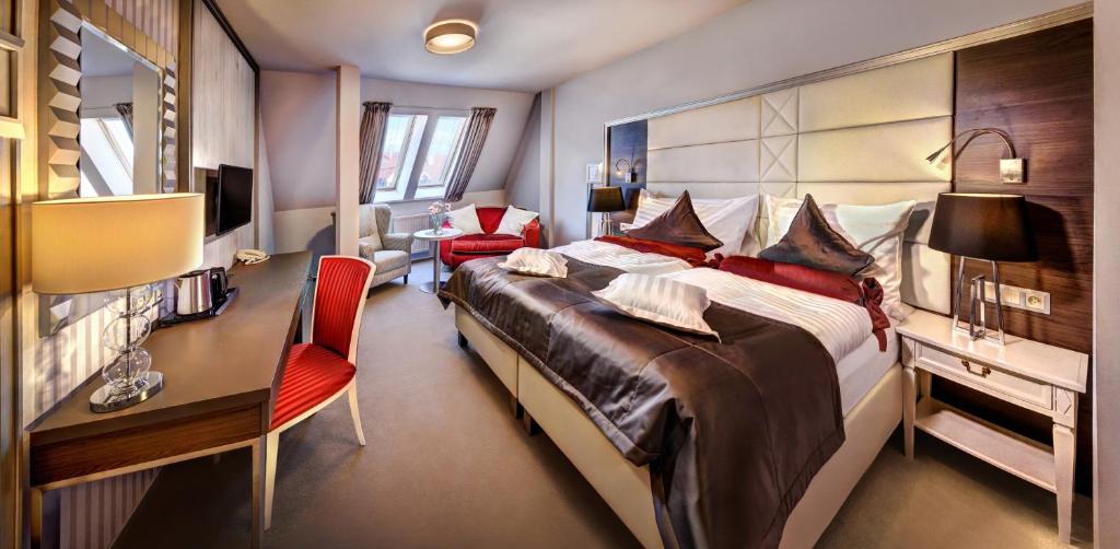 Postel nebo postele na pokoji v ubytování Boutique Hotel Hviezdoslav