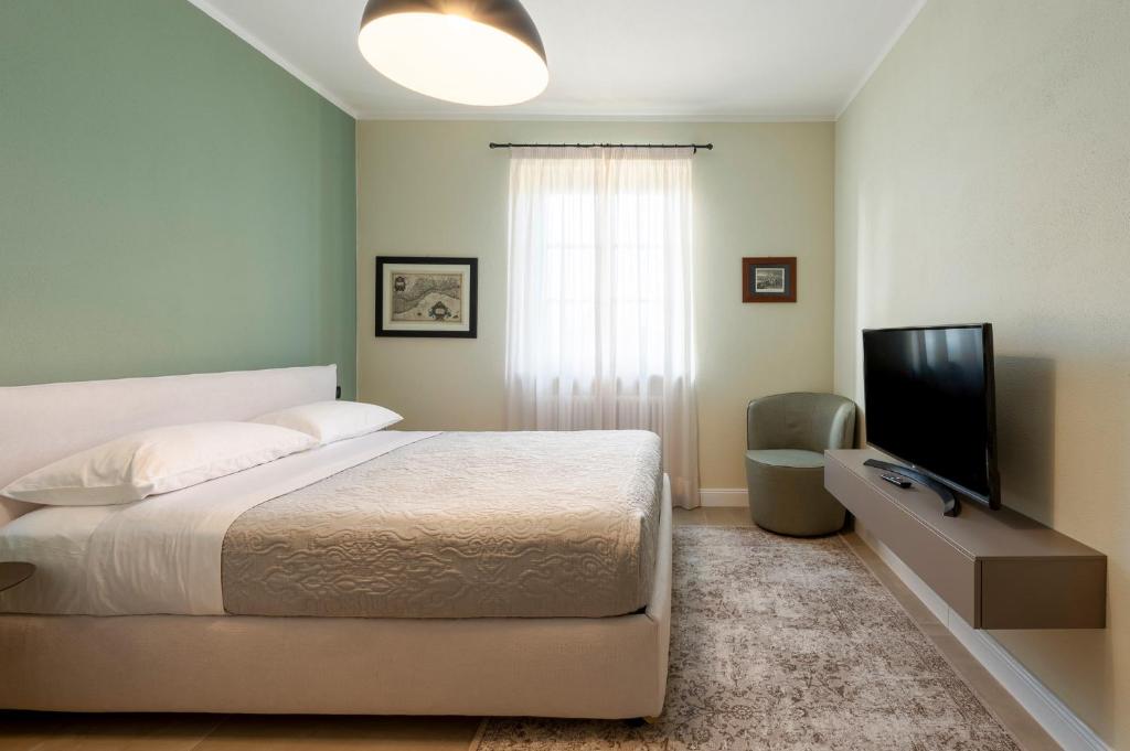 Postel nebo postele na pokoji v ubytování Villa Raggi