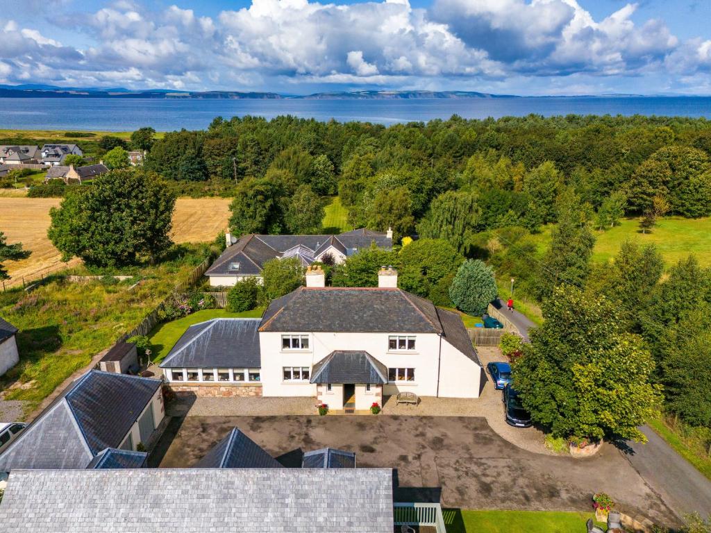 an aerial view of a large white house at Sandown House in Nairn
