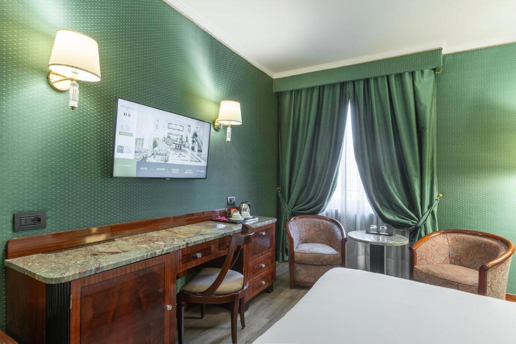 Postel nebo postele na pokoji v ubytování Doria Grand Hotel