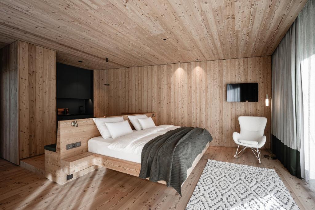 Postel nebo postele na pokoji v ubytování OLM Nature Escape - Eco Aparthotel