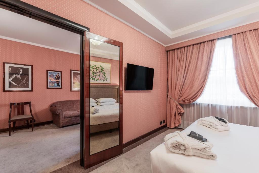 Postel nebo postele na pokoji v ubytování Doria Grand Hotel