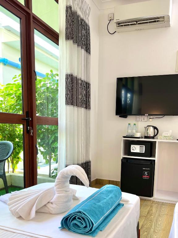 TV a/nebo společenská místnost v ubytování Balma Beach Inn