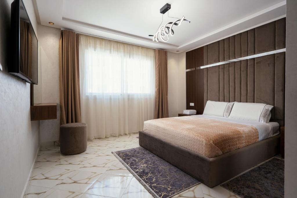 Postel nebo postele na pokoji v ubytování Appart-Hotel IMMOKA