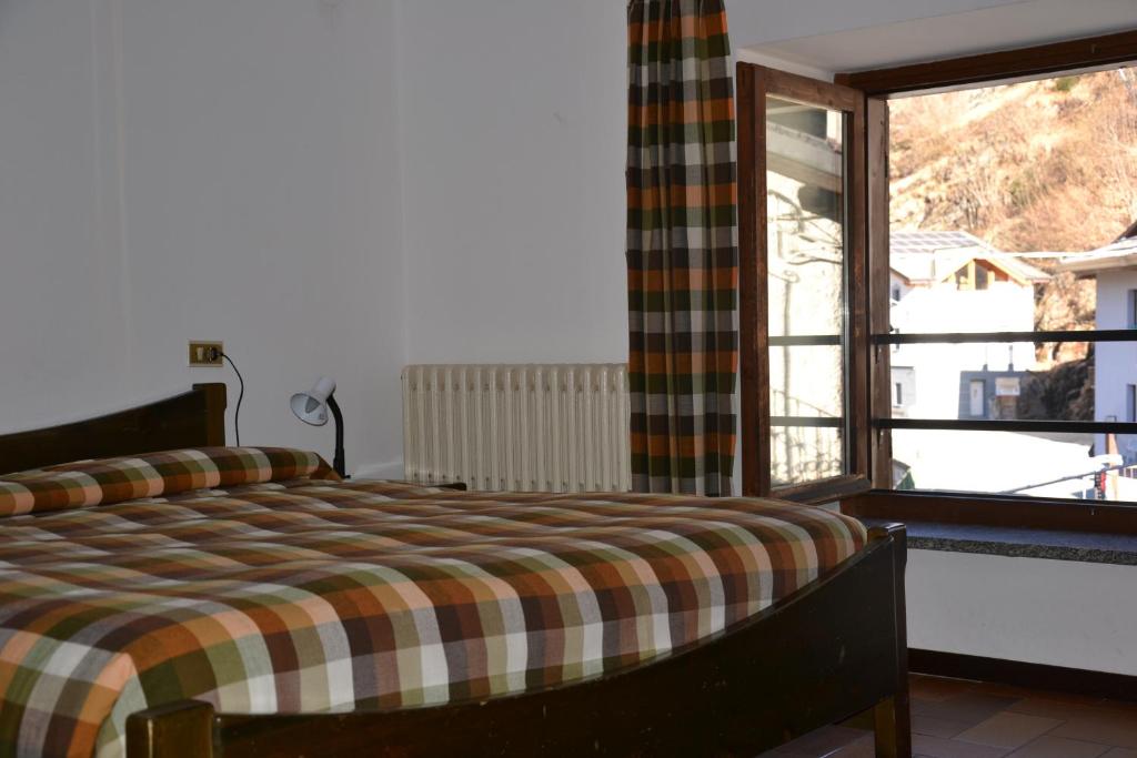 Postel nebo postele na pokoji v ubytování ALBERGO VALLUNGA