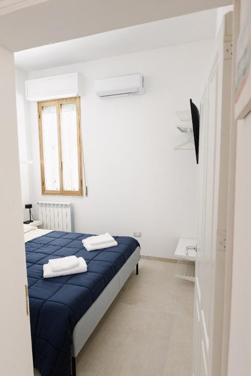 Postel nebo postele na pokoji v ubytování CasaRiso