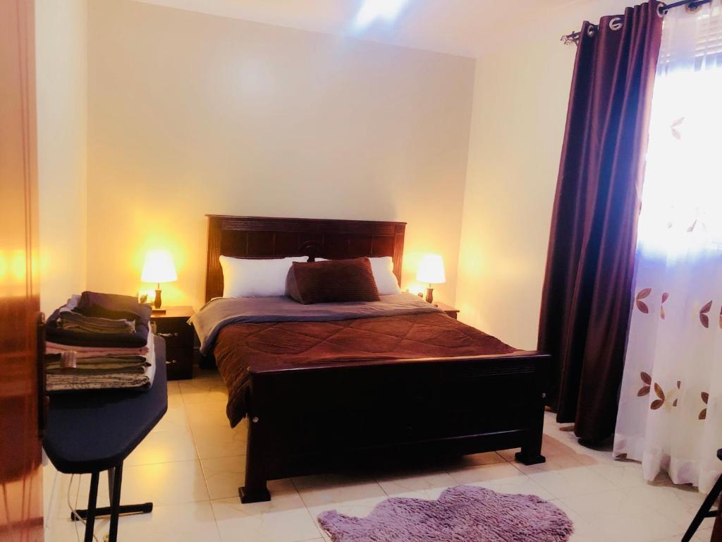 Ένα ή περισσότερα κρεβάτια σε δωμάτιο στο Zuri Comfy Retreat