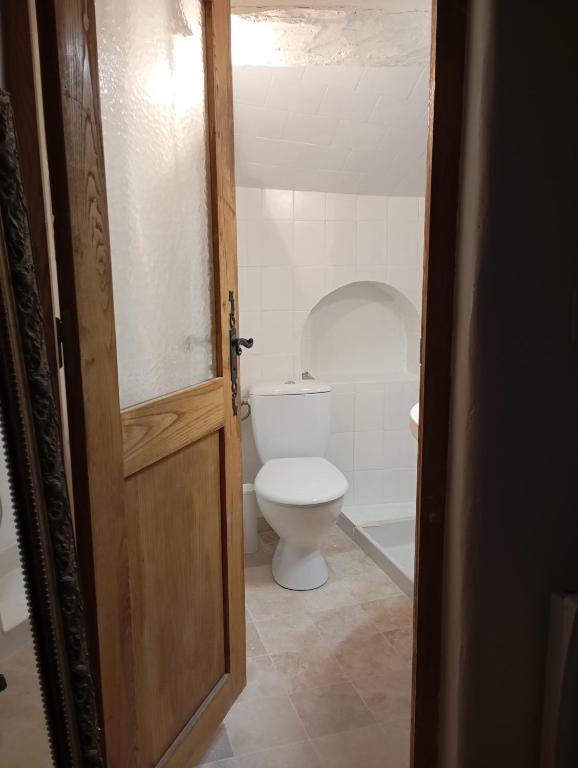 an open door to a bathroom with a toilet at Duplex au pied du Château in Cagnes-sur-Mer