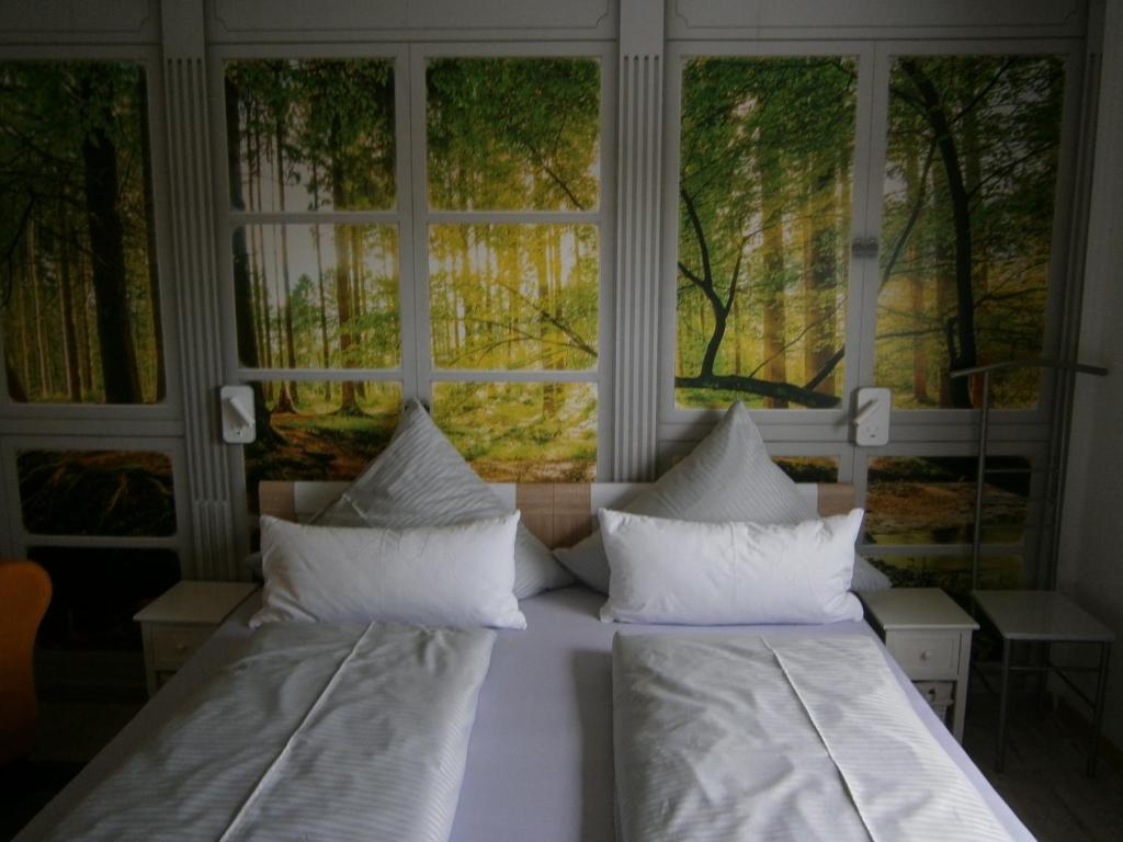 Кровать или кровати в номере Der Frühe Vogel