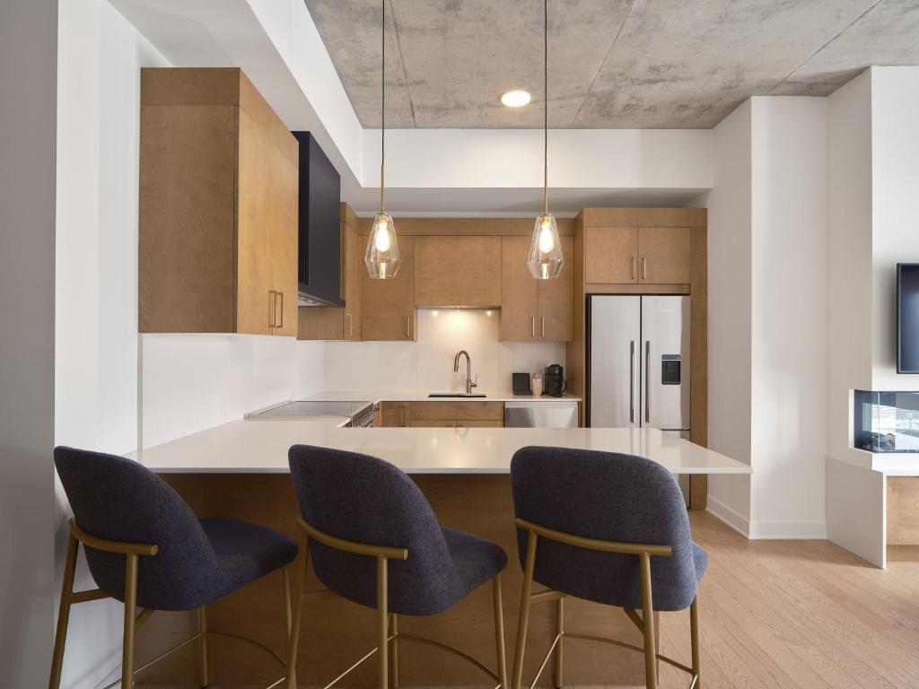 Kuchyň nebo kuchyňský kout v ubytování Hôtel - Expérience - Quartier Des Marinas