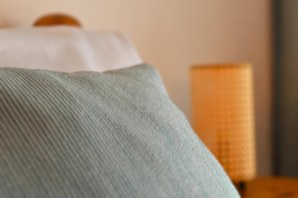 Postel nebo postele na pokoji v ubytování Ferienwohnungen Hotel Bellevue