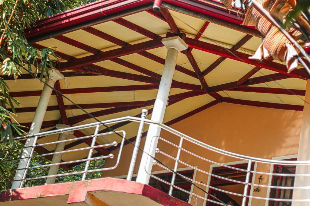 a balcony of a building with a metal railing at sisi place in Dickwella